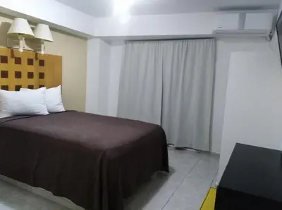 Cama o camas de una habitación en Hotel Posada del Carmen