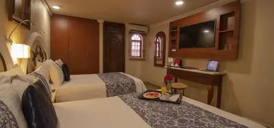 Cama o camas de una habitación en Arcángel Puebla