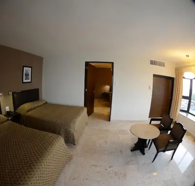 Cama o camas de una habitación en Hotel Mar y Tierra