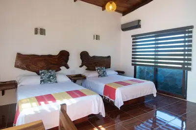 Cama o camas de una habitación en Casa Paraiso Hotel Boutique