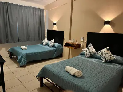 Cama o camas de una habitación en Hotel Las Brisas