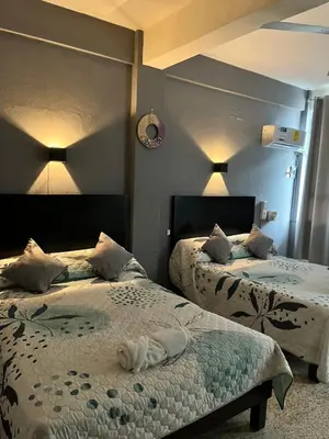 Cama o camas de una habitación en Hotel Las Brisas