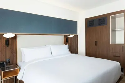 Cama o camas de una habitación en Courtyard by Marriott Puebla Las Animas