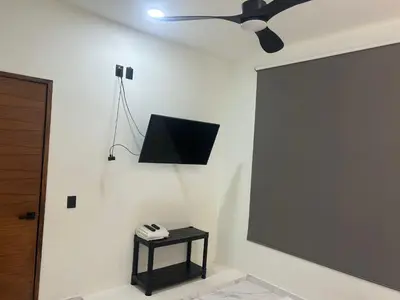 Una televisión o centro de entretenimiento en Casa Huatulco