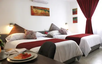 Cama o camas de una habitación en Astro Inn Hotel Express
