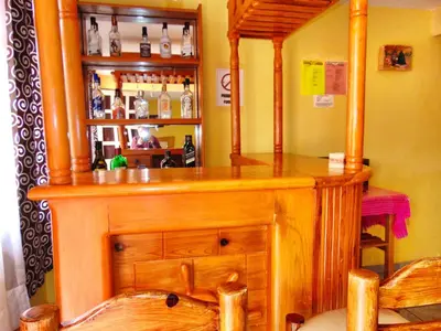 El salón o zona de bar de El paraíso de Zacatlán DEPARTAMENTO con JARDÍN y Lumbrera, 11 personas