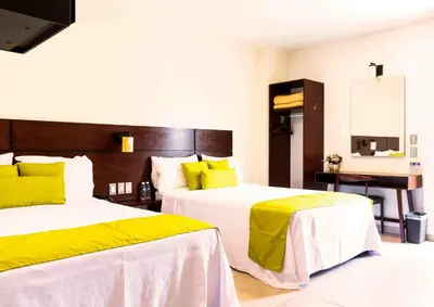 Cama o camas de una habitación en Hotel Real Alma