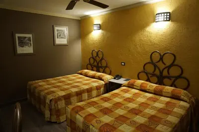 Cama o camas de una habitación en Hotel Plaza Crystal