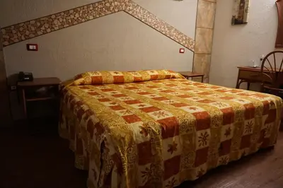 Cama o camas de una habitación en Hotel Plaza Crystal