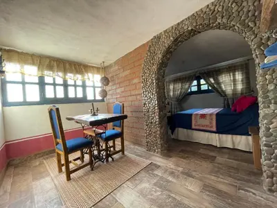 Cama o camas de una habitación en La Casona Azul Boutique Hotel