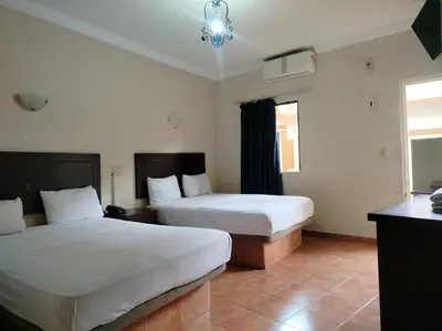 Cama o camas de una habitación en OYO Hotel Plaza Veracruz Centro Historico