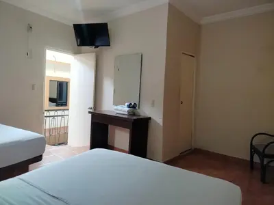Cama o camas de una habitación en OYO Hotel Plaza Veracruz Centro Historico