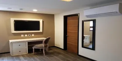 Una televisión o centro de entretenimiento en Mansion Azul Cholula