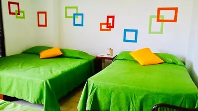 Cama o camas de una habitación en Hotel El Kiosco