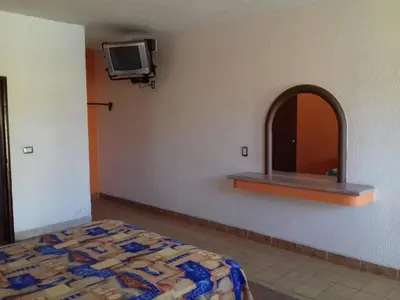 Cama o camas de una habitación en Promotora Hotelera Tocuila
