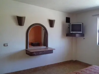 Una televisión o centro de entretenimiento en Promotora Hotelera Tocuila