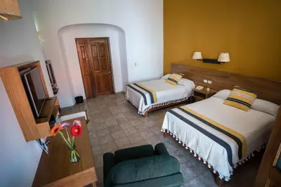 Cama o camas de una habitación en Parador San Agustin