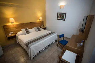 Cama o camas de una habitación en Parador San Agustin