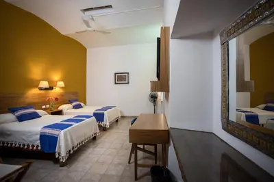 Cama o camas de una habitación en Parador San Agustin