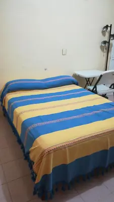 Cama o camas de una habitación en Amplias Y Confortables Habitaciones Amuebladas