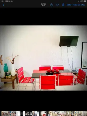 Una televisión o centro de entretenimiento en Casa Flores