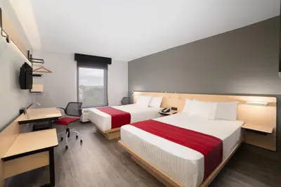 Cama o camas de una habitación en City Express by Marriott Puebla Centro