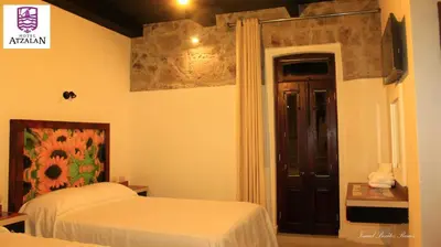 Cama o camas de una habitación en Hotel Atzalan
