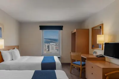 Cama o camas de una habitación en City Express by Marriott Tuxtla Gutiérrez