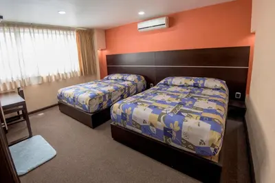 Cama o camas de una habitación en Oaxaca Inn Reforma