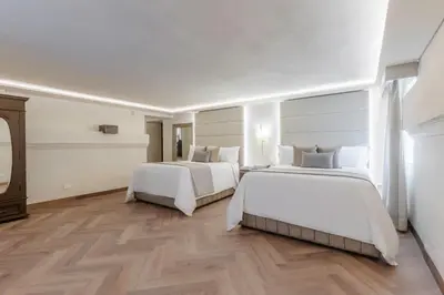 Cama o camas de una habitación en Quinta Real Puebla