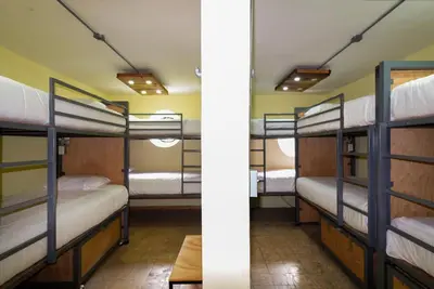 Cama o camas de una habitación en Hostalgia Casa Zul