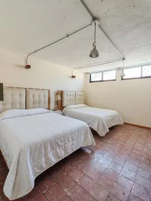 Cama o camas de una habitación en Hostalgia Casa Zul