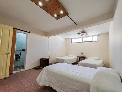 Cama o camas de una habitación en Hostalgia Casa Zul
