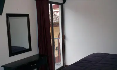 Cama o camas de una habitación en Hotel Avenida