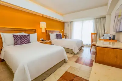 Cama o camas de una habitación en Camino Real Veracruz