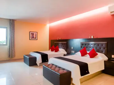 Cama o camas de una habitación en Veracruz Suites Hotel