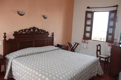 Cama o camas de una habitación en Hotel Posada Doña Lala