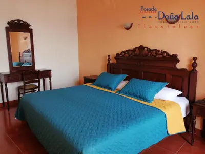 Cama o camas de una habitación en Hotel Posada Doña Lala
