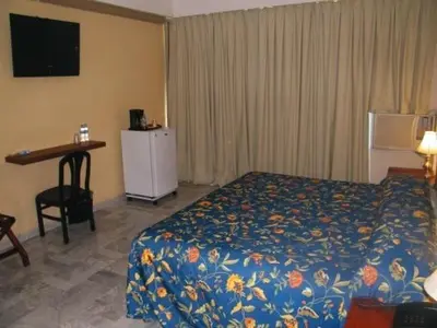 Cama o camas de una habitación en Parque Inn Hotel & Suites