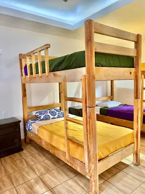 Cama o camas de una habitación en Hostal Amate Taxco