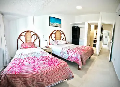 Cama o camas de una habitación en HominngBird Acapulco