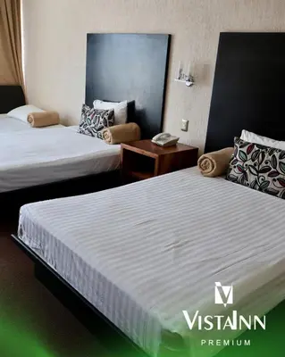 Cama o camas de una habitación en Hotel Vista Inn Premium