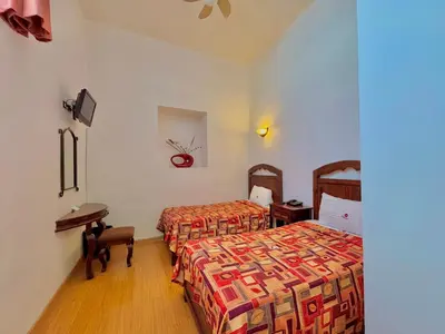 Cama o camas de una habitación en Hotel La Alhondiga