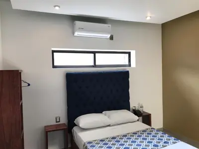 Cama o camas de una habitación en Hotel Plaza Amalia