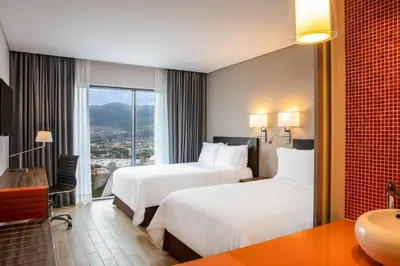 Cama o camas de una habitación en Fiesta Inn Tuxtla Fashion Mall