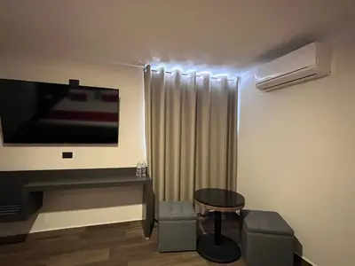 Una televisión o centro de entretenimiento en Hotel Granada