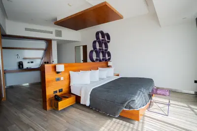 Cama o camas de una habitación en Sonata Hotel Puebla Angelópolis Distrito Sonata