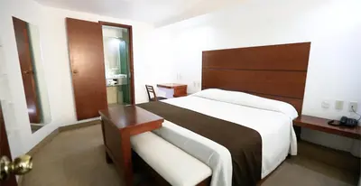 Cama o camas de una habitación en GS Jerocs Tlaxcala