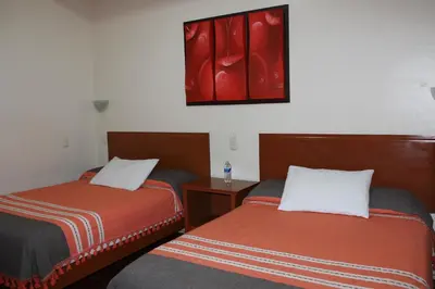 Cama o camas de una habitación en Hotel Oaxaca Mágico
