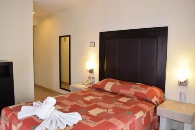 Cama o camas de una habitación en Hotel Posada Guadalupe